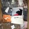 The photo shows a package with clothing in the category AP.