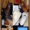 The photo shows a package with footwear in the category AS.