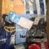 The photo shows a package with clothing in the category H.
