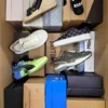 The photo shows a package with footwear in the category AS.