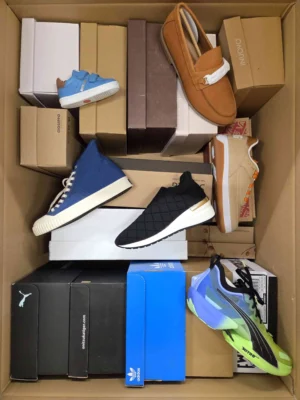 The photo shows a package with footwear in the category AS.