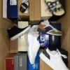 The photo shows a package with footwear in the category AS.