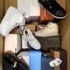 The photo shows a package with footwear in the category AS.