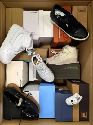 The photo shows a package with footwear in the category AS.