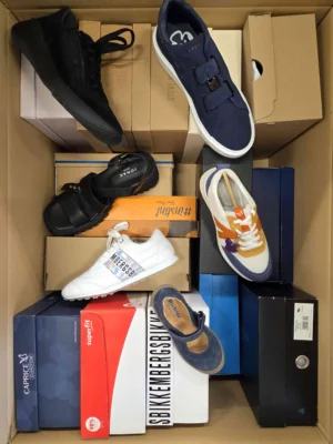 The photo shows a package with footwear in the category AS.