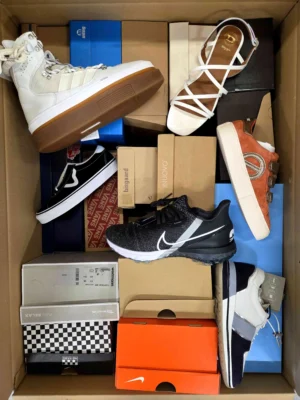 The photo shows a package with footwear in the category AS.