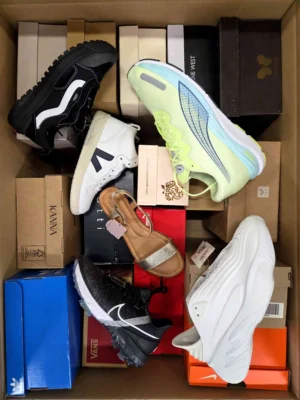 The photo shows a package with footwear in the category AS.