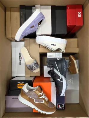 The photo shows a package with footwear in the category AS.