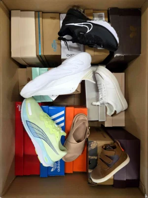 The photo shows a package with footwear in the category AS.