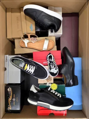 The photo shows a package with footwear in the category AS.