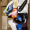 The photo shows a package with footwear in the category AS.