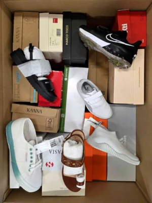 The photo shows a package with footwear in the category AS.