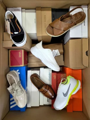 The photo shows a package with footwear in the category AS.