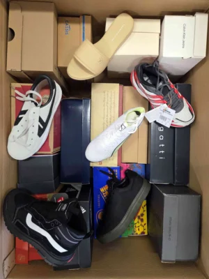 The photo shows a package with footwear in the category AS.