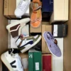 The photo shows a package with footwear in the category AS.
