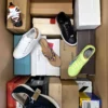 The photo shows a package with footwear in the category AS.