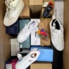 The photo shows a package with footwear in the category AS.