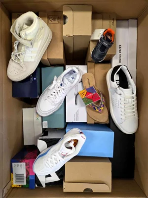 The photo shows a package with footwear in the category AS.