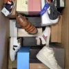 The photo shows a package with footwear in the category AS.