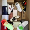The photo shows a package with footwear in the category AS.
