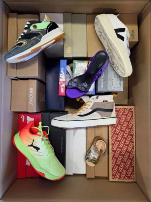 The photo shows a package with footwear in the category AS.