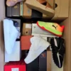 The photo shows a package with footwear in the category AS.