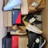 The photo shows a package with footwear in the category AS.