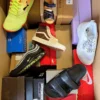 The photo shows a package with footwear in the category AS.