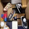 The photo shows a package with footwear in the category AS.