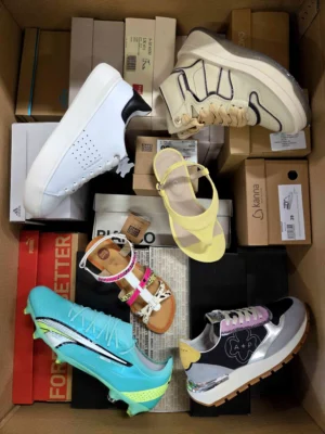 The photo shows a package with footwear in the category AS.