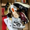 The photo shows a package with footwear in the category AS.