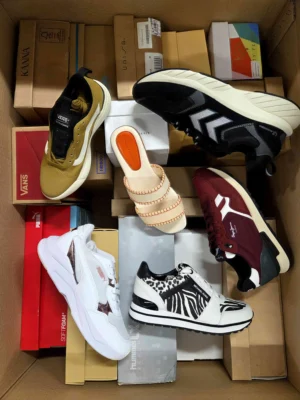 The photo shows a package with footwear in the category AS.