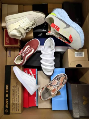 The photo shows a package with footwear in the category AS.