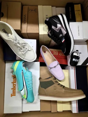 The photo shows a package with footwear in the category AS.