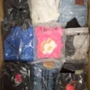 The photo shows a package with clothing in the category D.