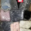 The photo shows a package with clothing in the category D.