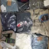 The photo shows a package with clothing in the category T.