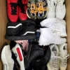 The photo shows a package with footwear in the category SH.