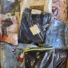 B1764 1 The photo shows a package with clothing in the category B.