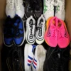 The photo shows a package with footwear in the category SH.
