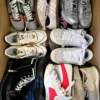 The photo shows a package with footwear in the category SH.