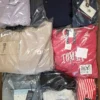 The photo shows a package with clothing in the category T.