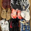 The photo shows a package with footwear in the category SH.