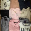 The photo shows a package with clothing in the category U.