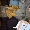 The photo shows a package with clothing in the category U.