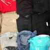 The photo shows a package with clothing in the category U.