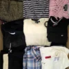 The photo shows a package with clothing in the category U.