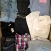 The photo shows a package with clothing in the category U.