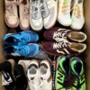 The photo shows a package with footwear in the category SH.