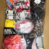 The photo shows a package with clothing in the category ABW.